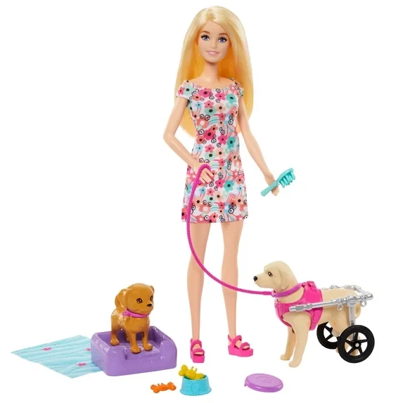 Barbie doll with two toy pups and pet accessories